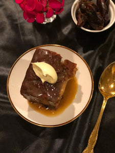 Home cooked Sticky date pudding with sauce and dollop cream